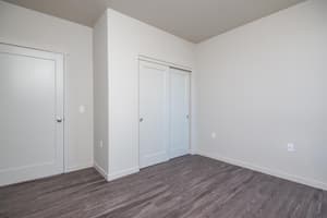 Bedroom with sliding closet doors at 459 Rock Apartments, 459 SE 192nd Ave, Gresham, Oregon 97233