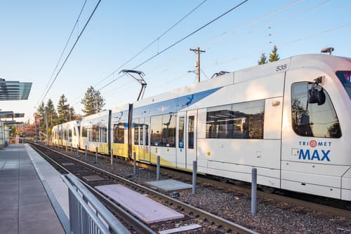 MAX Blue Line train near 459 Rock Apartments