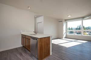 Kitchen with island and stainless steel appliances at 459 Rock Apartments, 459 SE 192nd Ave, Gresham, Oregon 97233