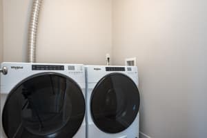 In-unit laundry with front-loading washer and dryer at 459 Rock Apartments, 459 SE 192nd Ave, Gresham, Oregon 97233