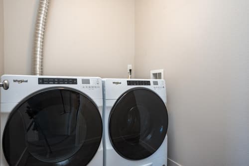 In-unit front-loading washer and dryer at 459 Rock Apartments