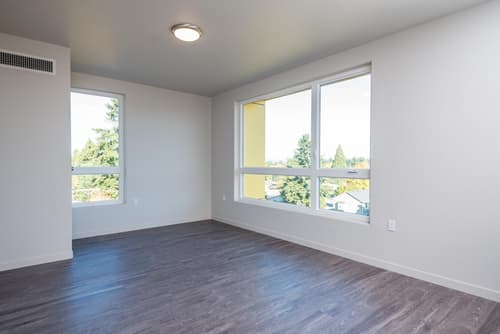 Living room with large windows at 459 Rock Apartments