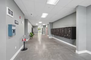 Hallway with mailboxes, concrete floor at 459 Rock Apartments, 459 SE 192nd Ave, Gresham, Oregon 97233