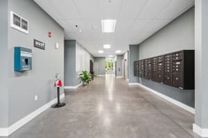 Hallway with mailboxes, concrete flooring at 459 Rock Apartments, 459 SE 192nd Ave, Gresham, Oregon 97233