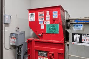 Storage with trash compactor, warning signs at 459 Rock Apartments, 459 SE 192nd Ave, Gresham, Oregon 97233