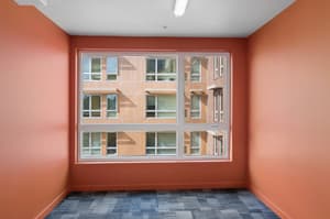 Hallway with large window, carpeted floor at 459 Rock Apartments, 459 SE 192nd Ave, Gresham, Oregon 97233