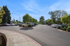 Exterior with parking lot, landscaped trees at 459 Rock Apartments, 459 SE 192nd Ave, Gresham, Oregon 97233