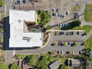 Aerial with parking lot, landscaped garden at 459 Rock Apartments, 459 SE 192nd Ave, Gresham, Oregon 97233