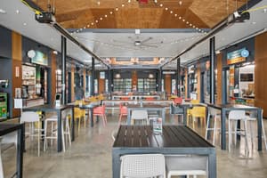 Dining area inside nearby Rockwood Market Hall near 459 Rock Apartments in Gresham, Oregon