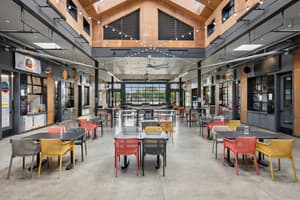 Open dining area inside nearby Rockwood Market Hall near 459 Rock Apartments in Gresham, Oregon