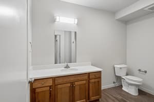 Bathroom with wood vanity, wall lighting at 459 Rock Apartments, 459 SE 192nd Ave, Gresham, Oregon 97233