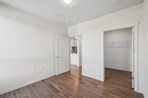 Bedroom with hardwood floors, walk in closet at 459 Rock Apartments, 459 SE 192nd Ave, Gresham, Oregon 97233