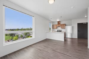 Living Room with large windows, hardwood floors at 459 Rock Apartments, 459 SE 192nd Ave, Gresham, Oregon 97233
