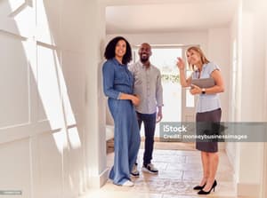 Leasing agent showing an apartment to prospective renters